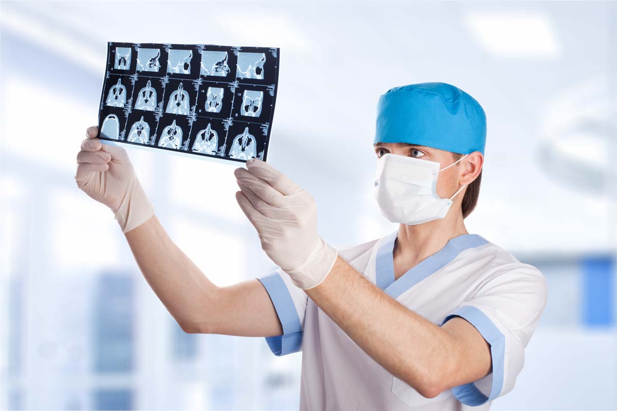 Doctor Shows The Process Of Scanning A Patient Stock Photo